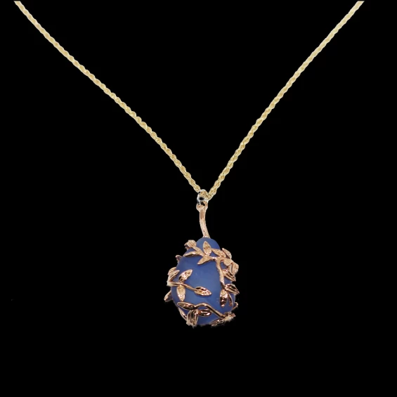 Cobalt sea glass wrapped in gold leaves necklace