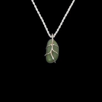 Small green sea glass wrapped in sterling silver branches