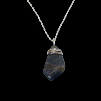 Necklace with a multi-colored polished stone from Newfoundland wrapped in sterling silver wire