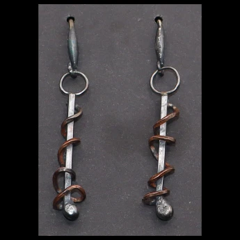Industrial style copper / silver earrings with a patina finish.