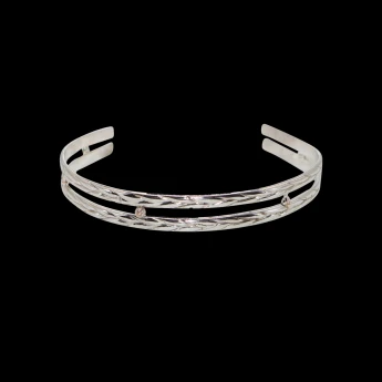 Women's braided sterling silver bracelet with gold ball spacers.