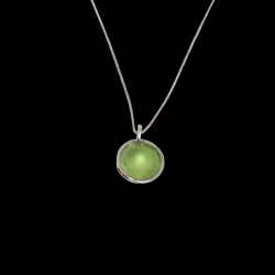 Green sea glass in a sterling silver half domed cup.
