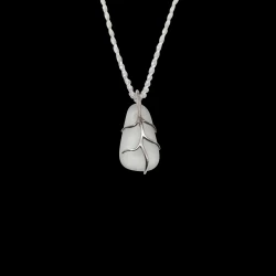 White sea glass with sterling silver embraced branches.  1/2" in size