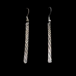 Pressed sterling silver dangle earrings finished with a dark patina wash