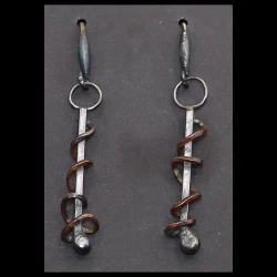 Industrial style copper / silver earrings with a patina finish.