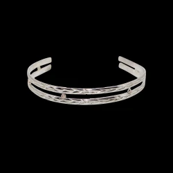 Women's braided sterling silver bracelet with gold ball spacers.